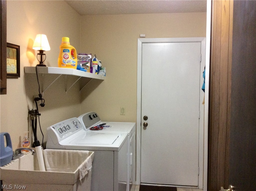 10797 Waterfall Road Strongsville, OH 44149 - Photo 20 of 23 Separate utility room doubles as mud room from garage. Washer and dryer to stay. Note utility tub!