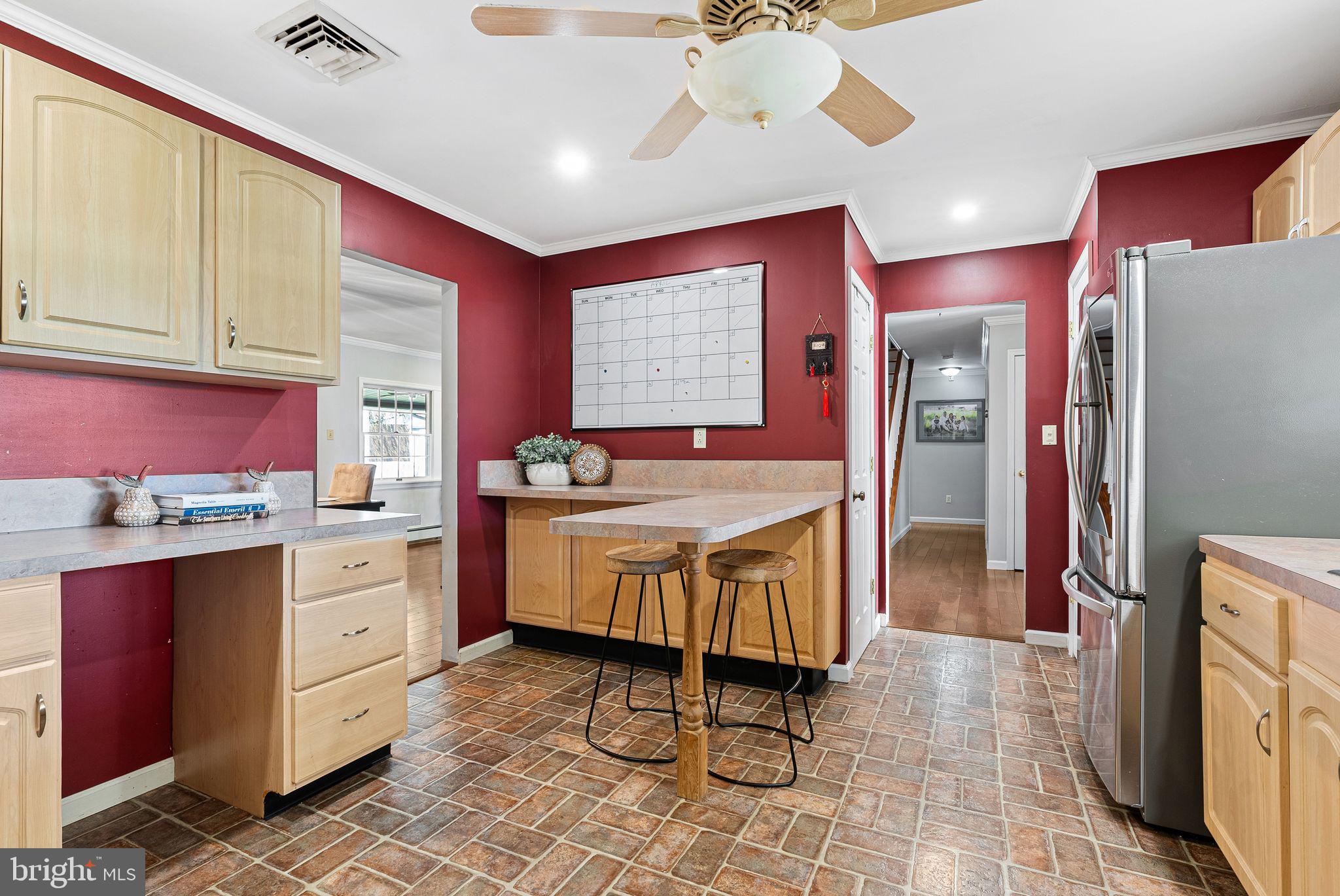 48 Silverbell Road Levittown, PA 19056 - Photo 12 of 35 a kitchen with granite countertop a sink appliances cabinets and furniture