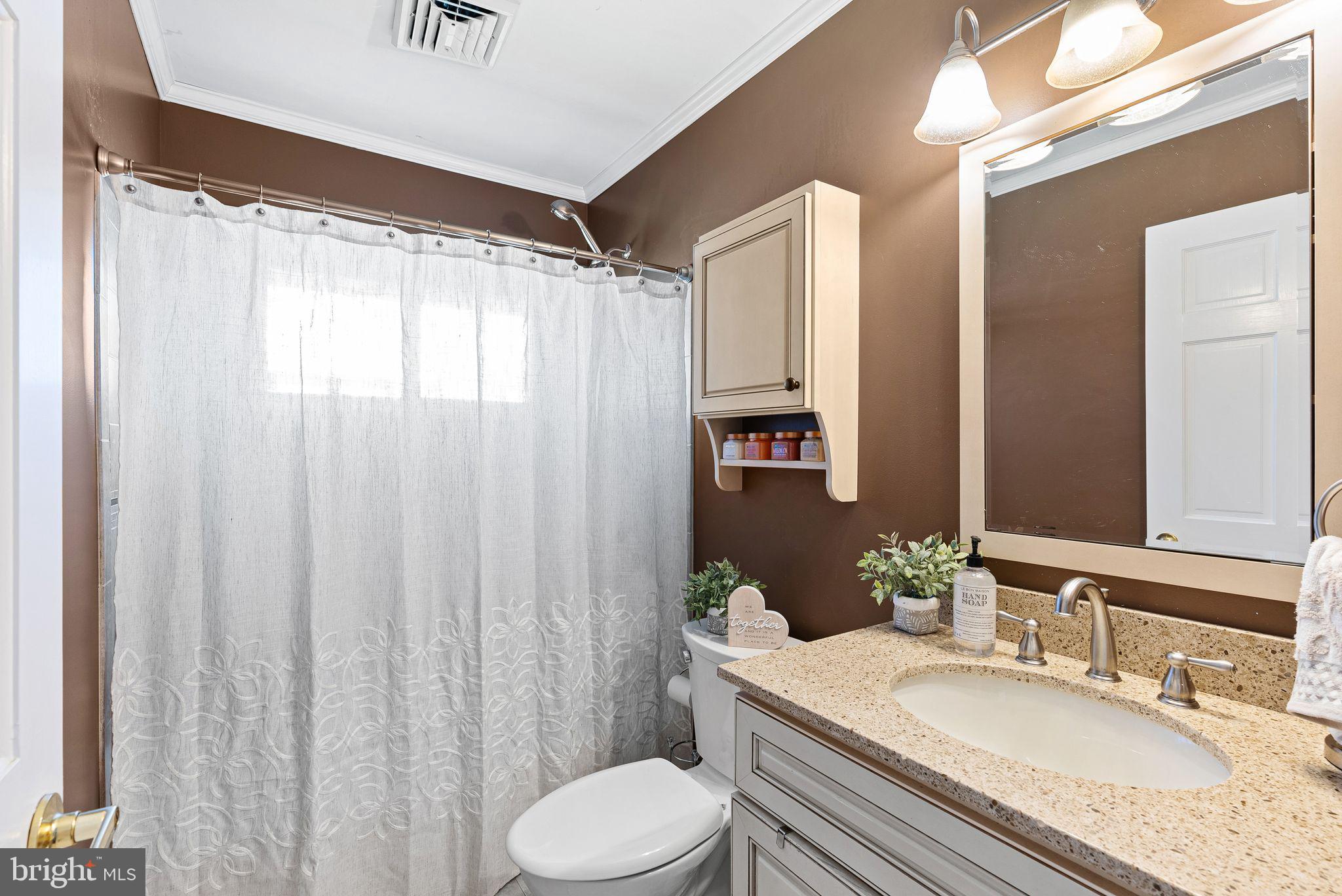 48 Silverbell Road Levittown, PA 19056 - Photo 20 of 35 a bathroom with a granite countertop sink toilet and shower