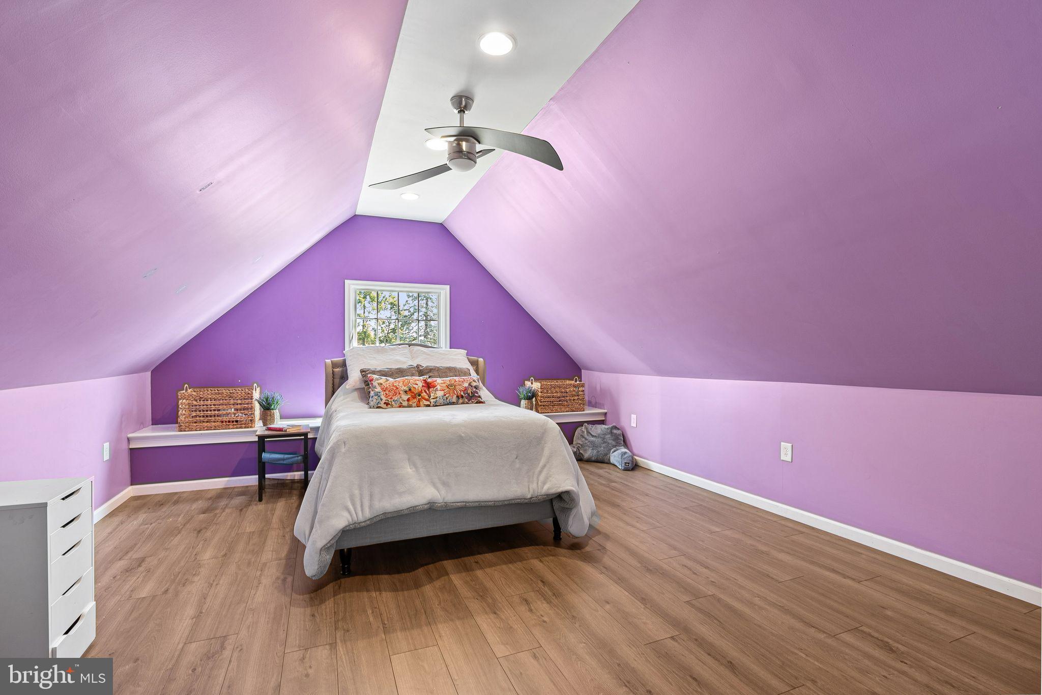 48 Silverbell Road Levittown, PA 19056 - Photo 23 of 35 a bedroom with a bed and a chandelier