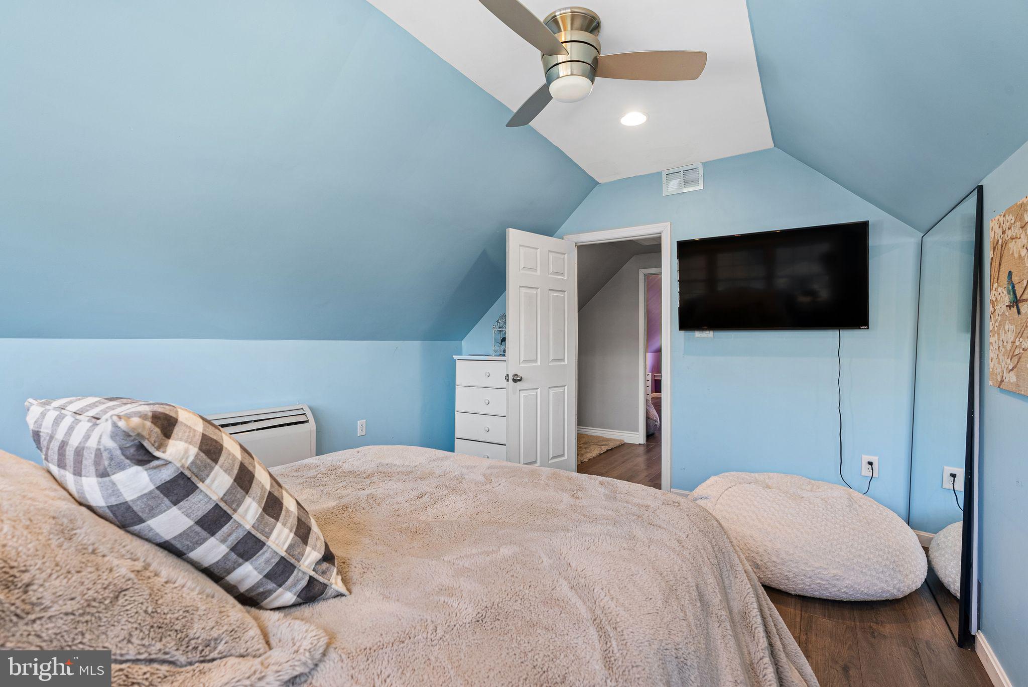 48 Silverbell Road Levittown, PA 19056 - Photo 26 of 35 a bedroom with a large bed and a flat screen tv