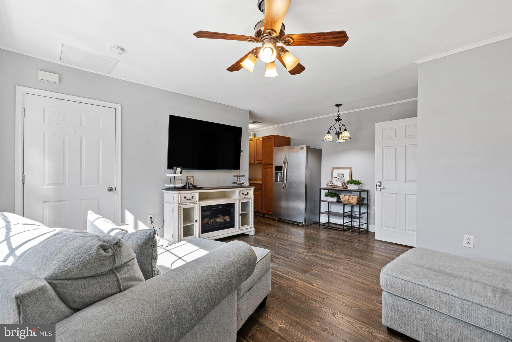 48 Silverbell Road Levittown, PA 19056 - Photo 29 of 35 a living room with furniture and a flat screen tv