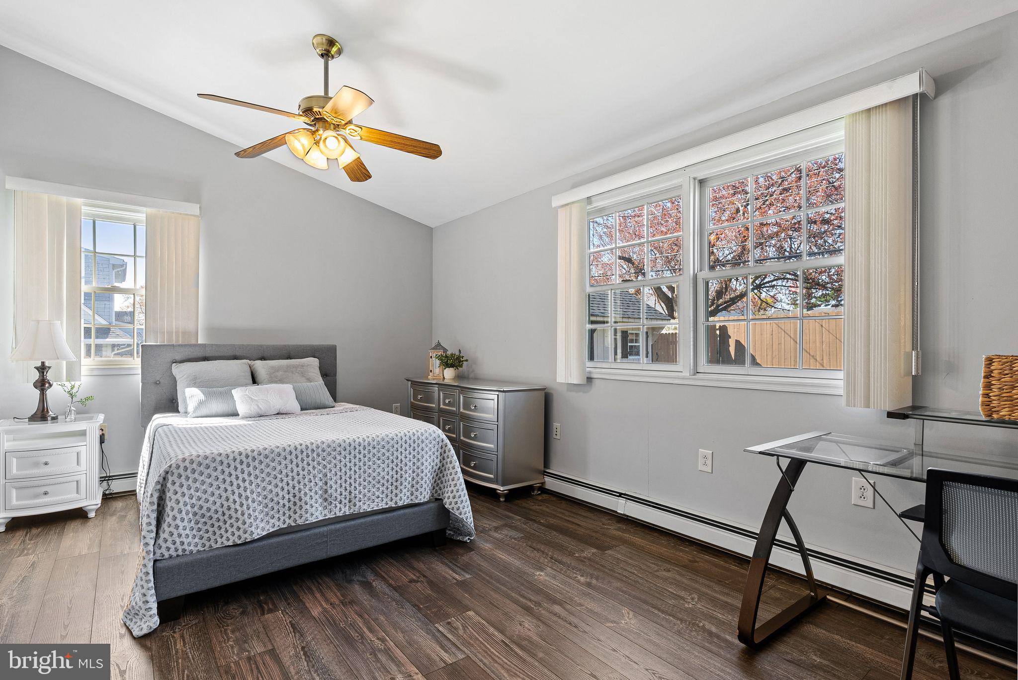 48 Silverbell Road Levittown, PA 19056 - Photo 31 of 35 a bedroom with a large bed and a chandelier