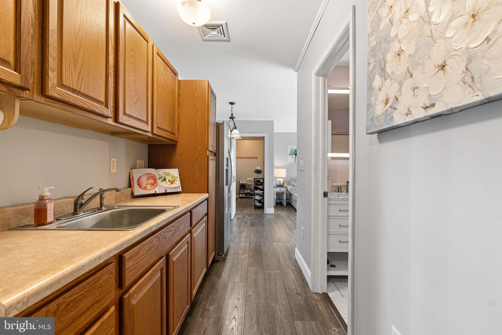 48 Silverbell Road Levittown, PA 19056 - Photo 33 of 35 a kitchen with a sink and cabinets