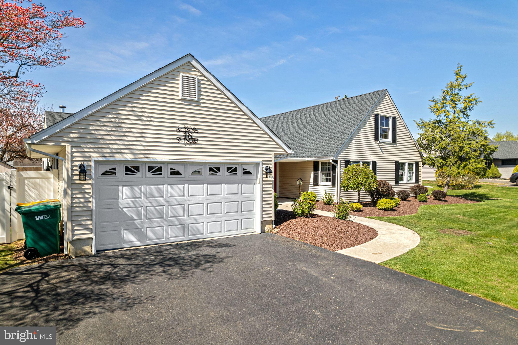 48 Silverbell Road Levittown, PA 19056 - Photo 4 of 35 a front view of a house with a yard and garage