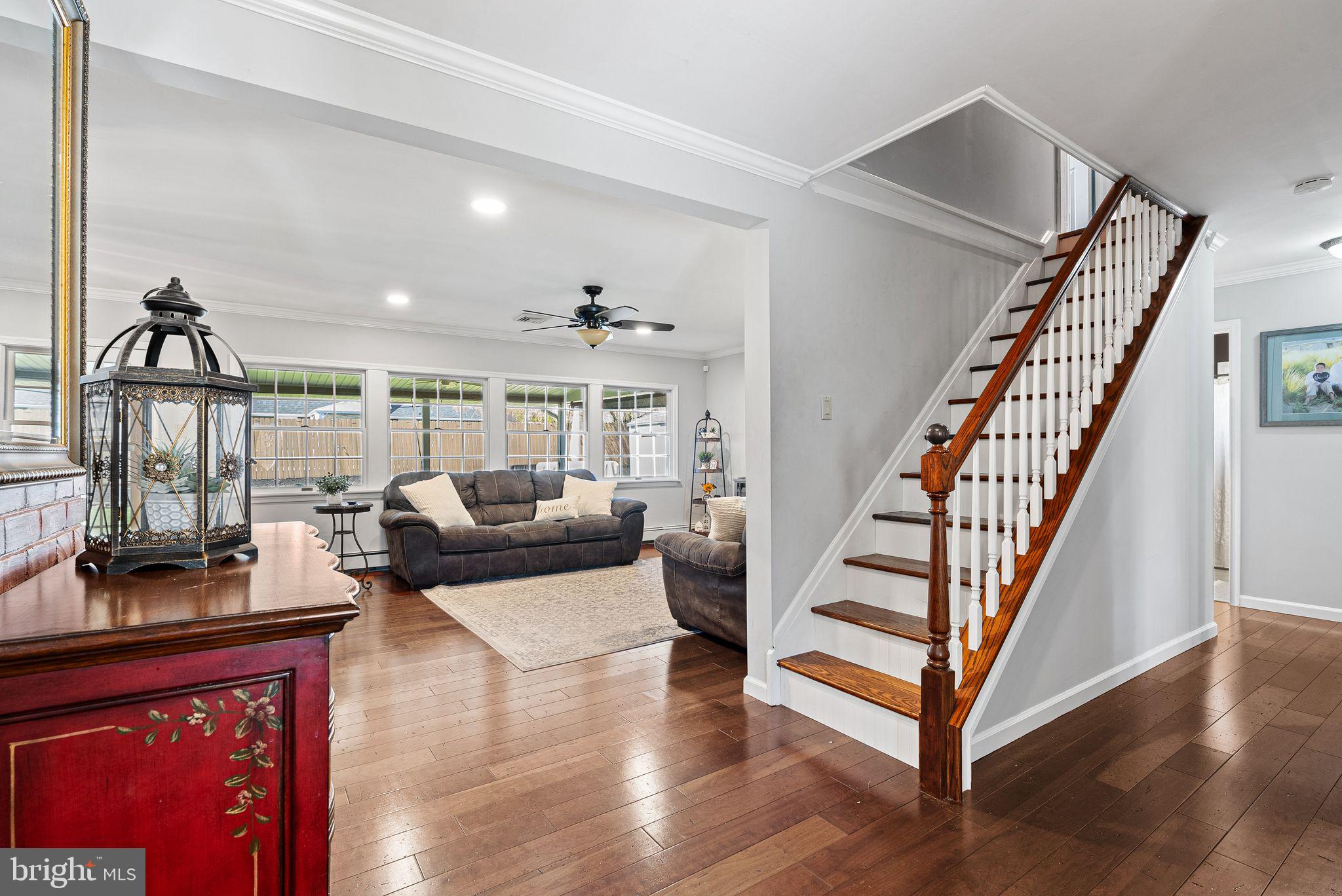 48 Silverbell Road Levittown, PA 19056 - Photo 7 of 35 a living room with furniture and wooden floor