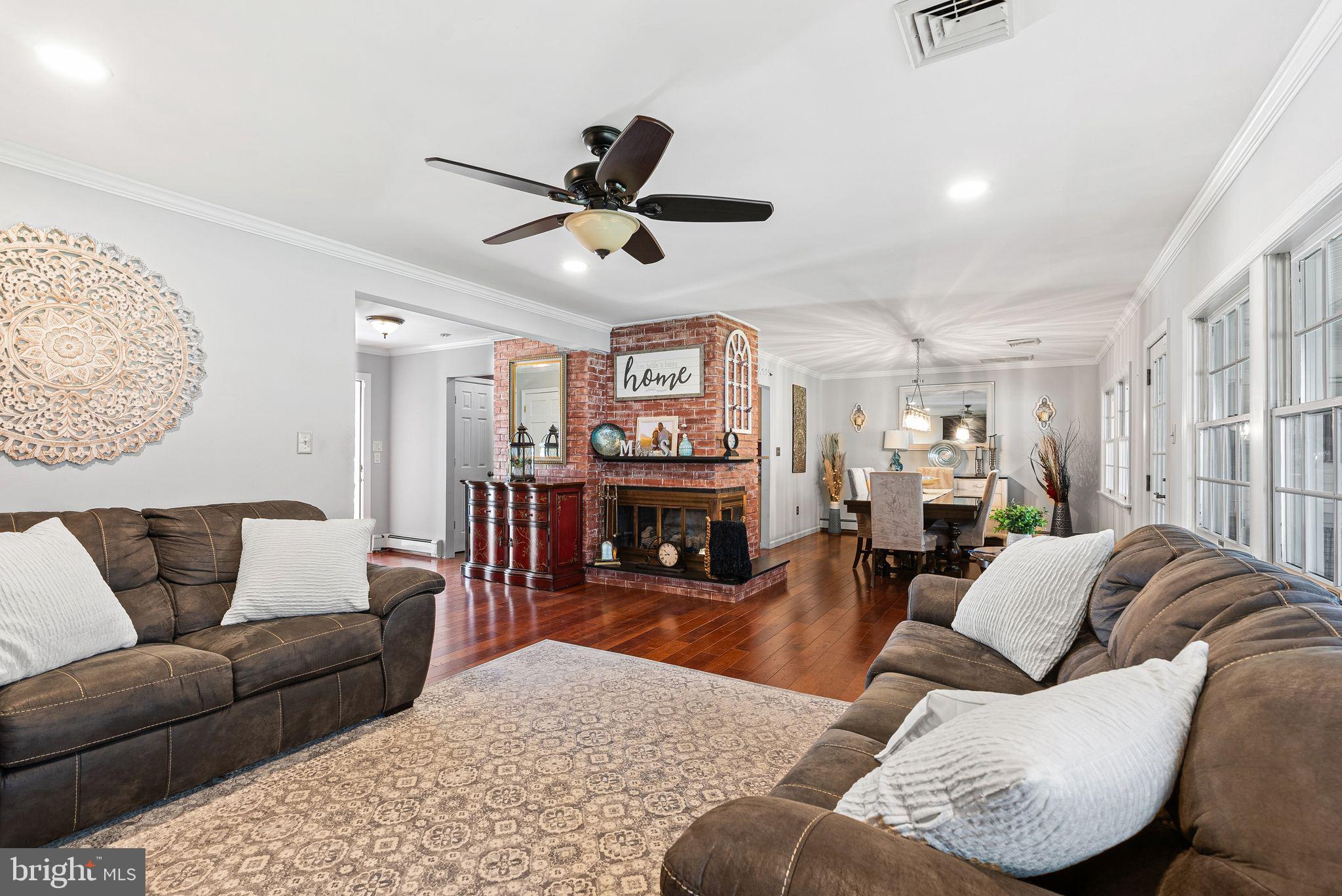 48 Silverbell Road Levittown, PA 19056 - Photo 8 of 35 a living room with furniture and a fireplace