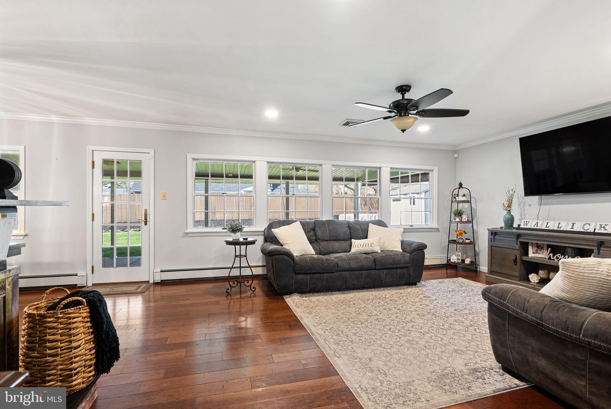 48 Silverbell Road Levittown, PA 19056 - Photo 9 of 35 a living room with furniture and a flat screen tv