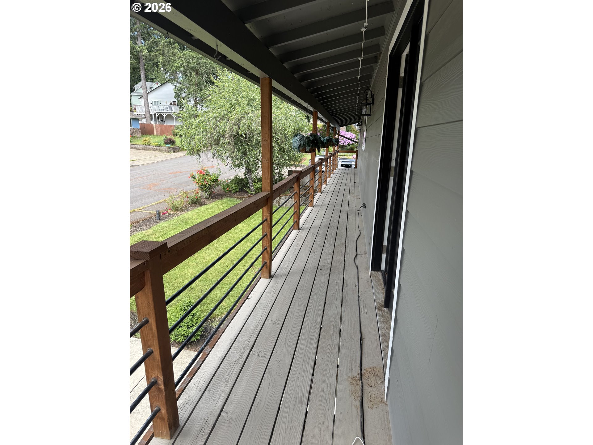 6974 Glacier Drive Springfield, OR 97478 - Photo 27 of 37 a view of balcony with wooden floor