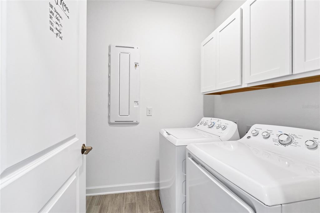 5656 Quiet Palm Loop St. Cloud, FL 34771 - Photo 21 of 36 a utility room with dryer and washer