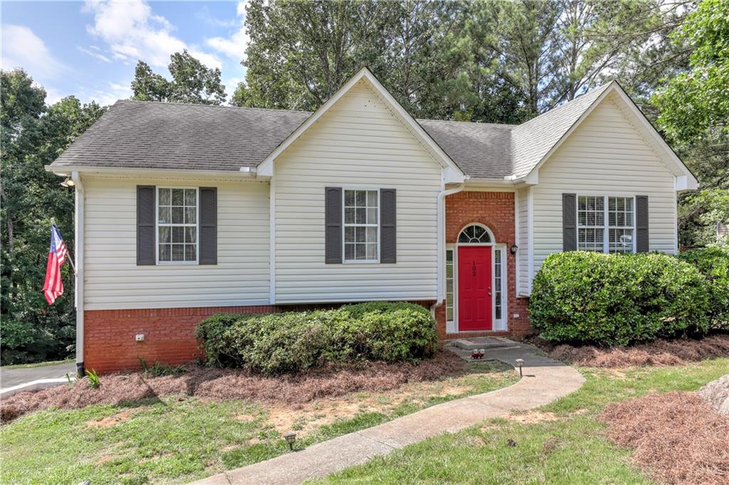 a front view of a house with a yard