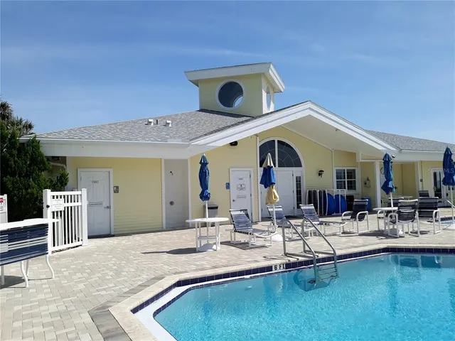 a view of living room with kitchen island stainless steel appliances wooden floor and living room view