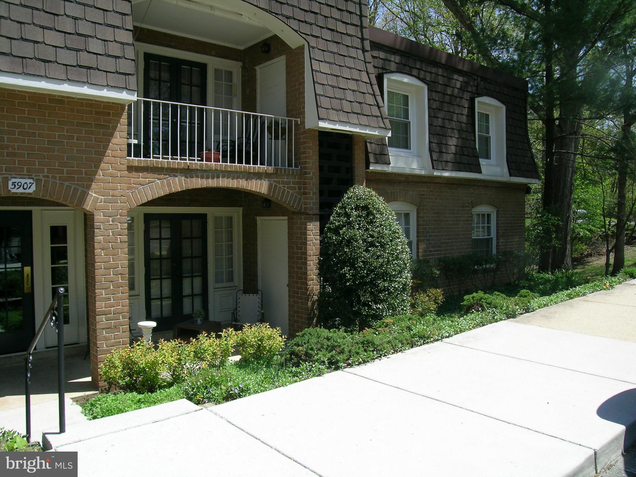 5907 Bayshire Road, Unit 189 Springfield, VA 22152 - Photo 2 of 21 a front view of a house with garden