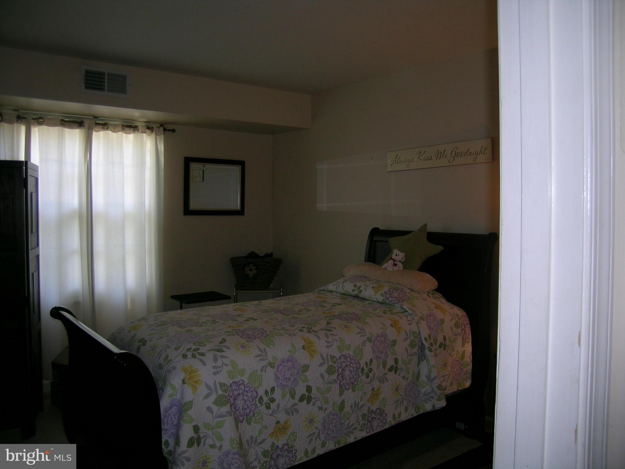 5907 Bayshire Road, Unit 189 Springfield, VA 22152 - Photo 13 of 21 a bedroom with a bed and a window