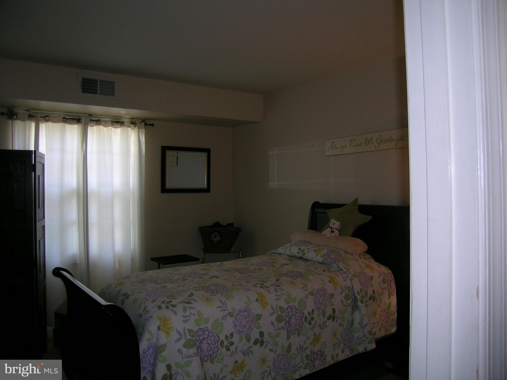 5907 Bayshire Road, Unit 189 Springfield, VA 22152 - Photo 14 of 21 a bedroom with a bed and a window