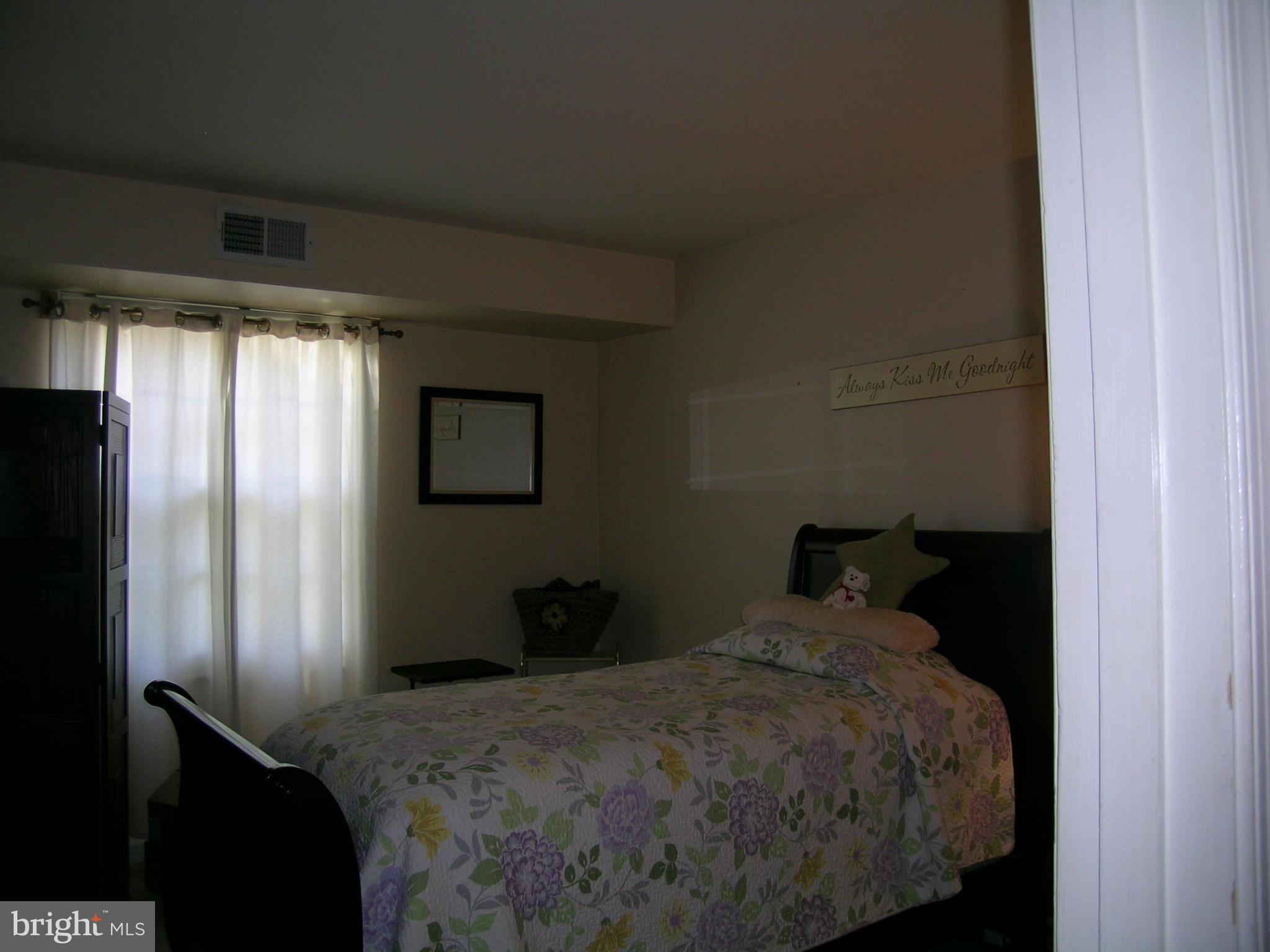 5907 Bayshire Road, Unit 189 Springfield, VA 22152 - Photo 15 of 21 a bedroom with a bed and a window