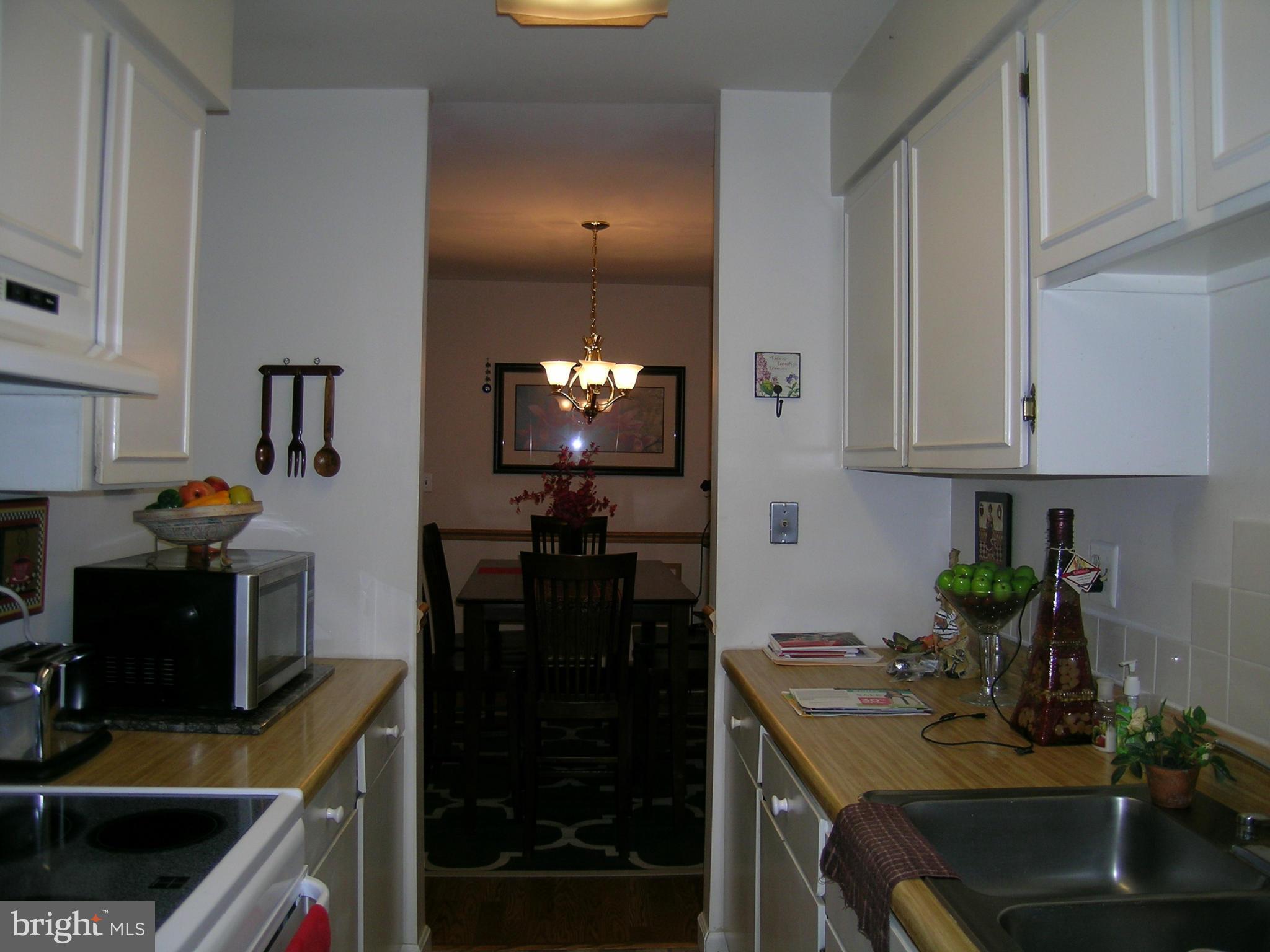 5907 Bayshire Road, Unit 189 Springfield, VA 22152 - Photo 20 of 21 a kitchen with sink and cabinets