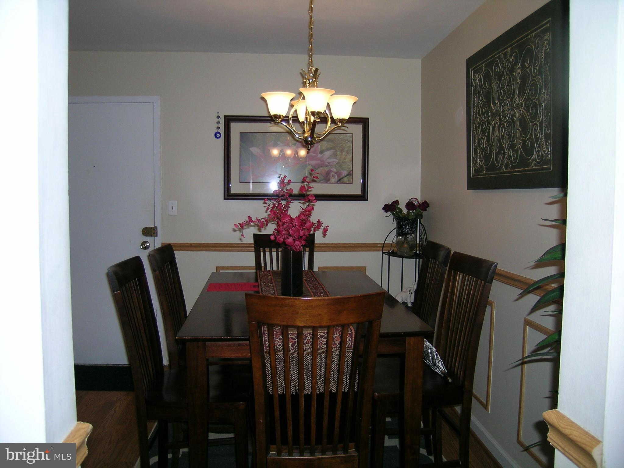 5907 Bayshire Road, Unit 189 Springfield, VA 22152 - Photo 21 of 21 a view of a dining room with furniture and chandelier