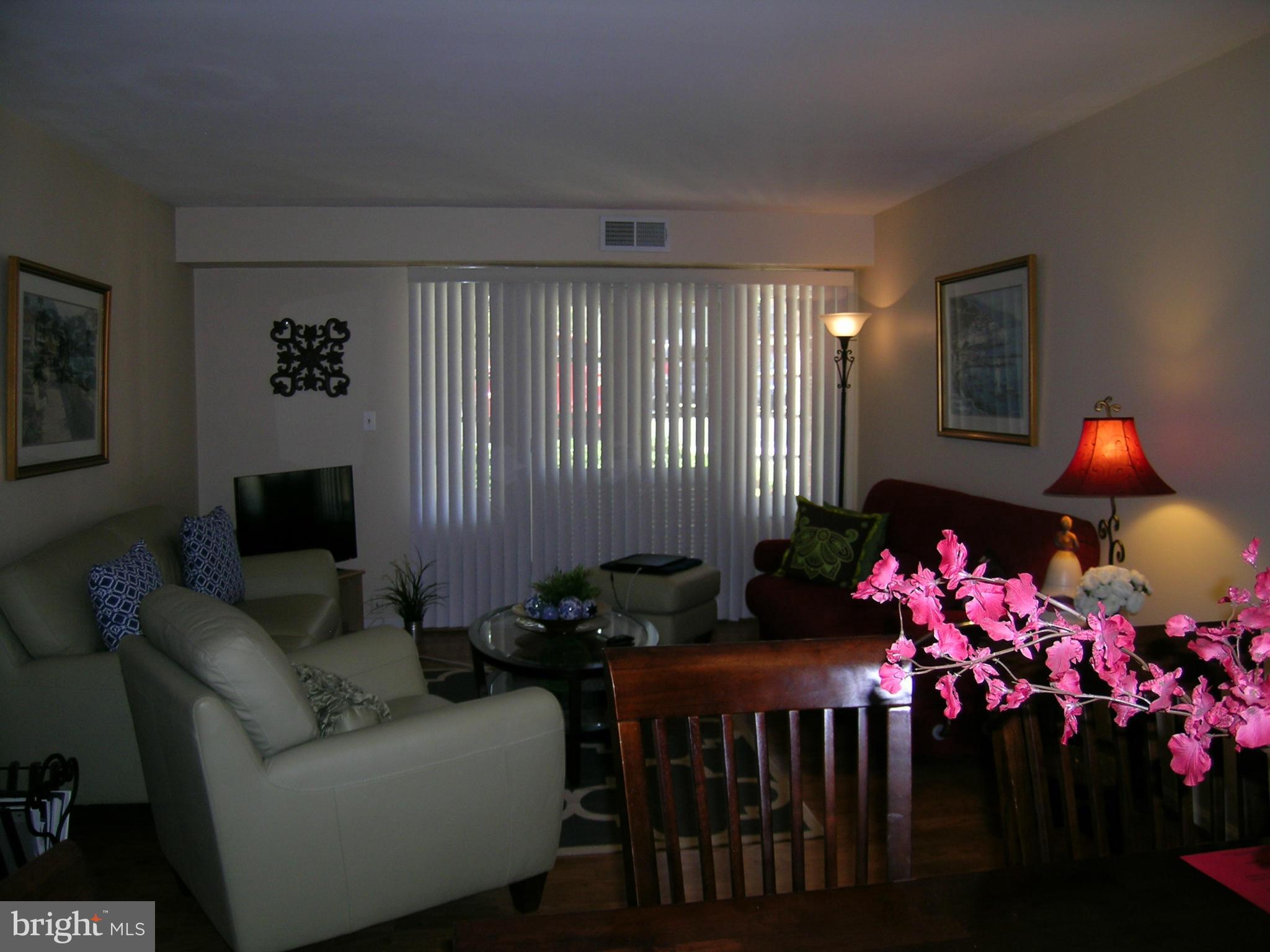 5907 Bayshire Road, Unit 189 Springfield, VA 22152 - Photo 7 of 21 a living room with furniture and flowers