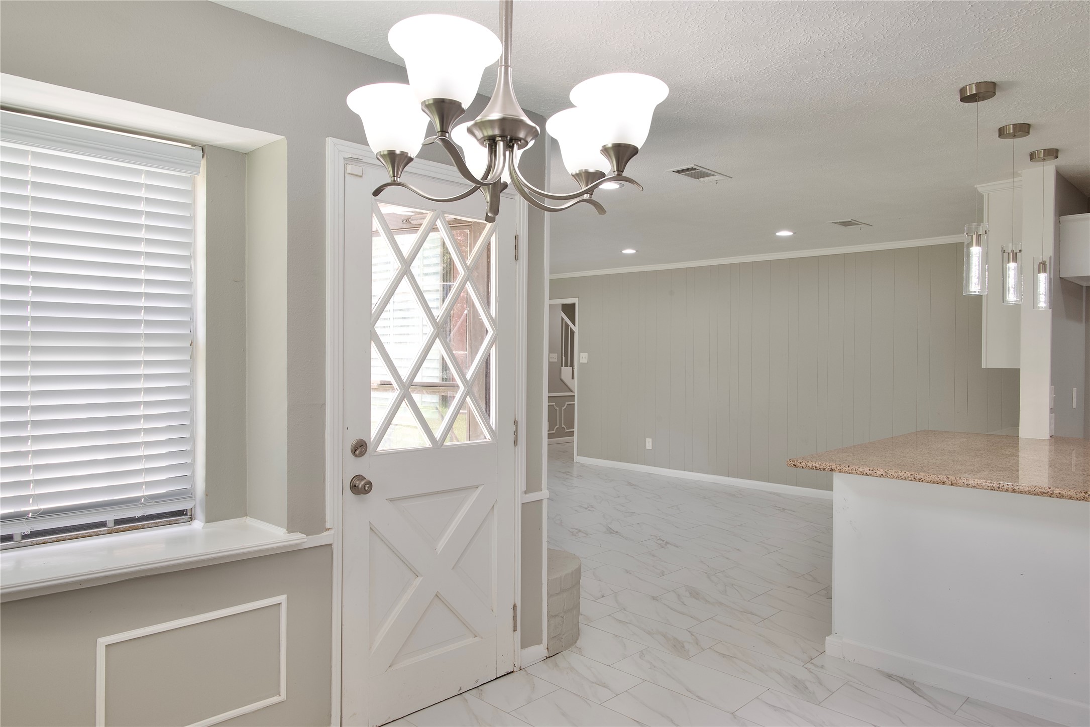 723 Leaflet Lane Spring, TX 77388 - Photo 19 of 41 a view of a bathroom with a sink a chandelier and a mirror