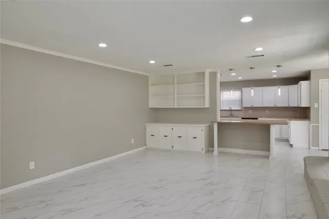 a view of kitchen with stainless steel appliances cabinets