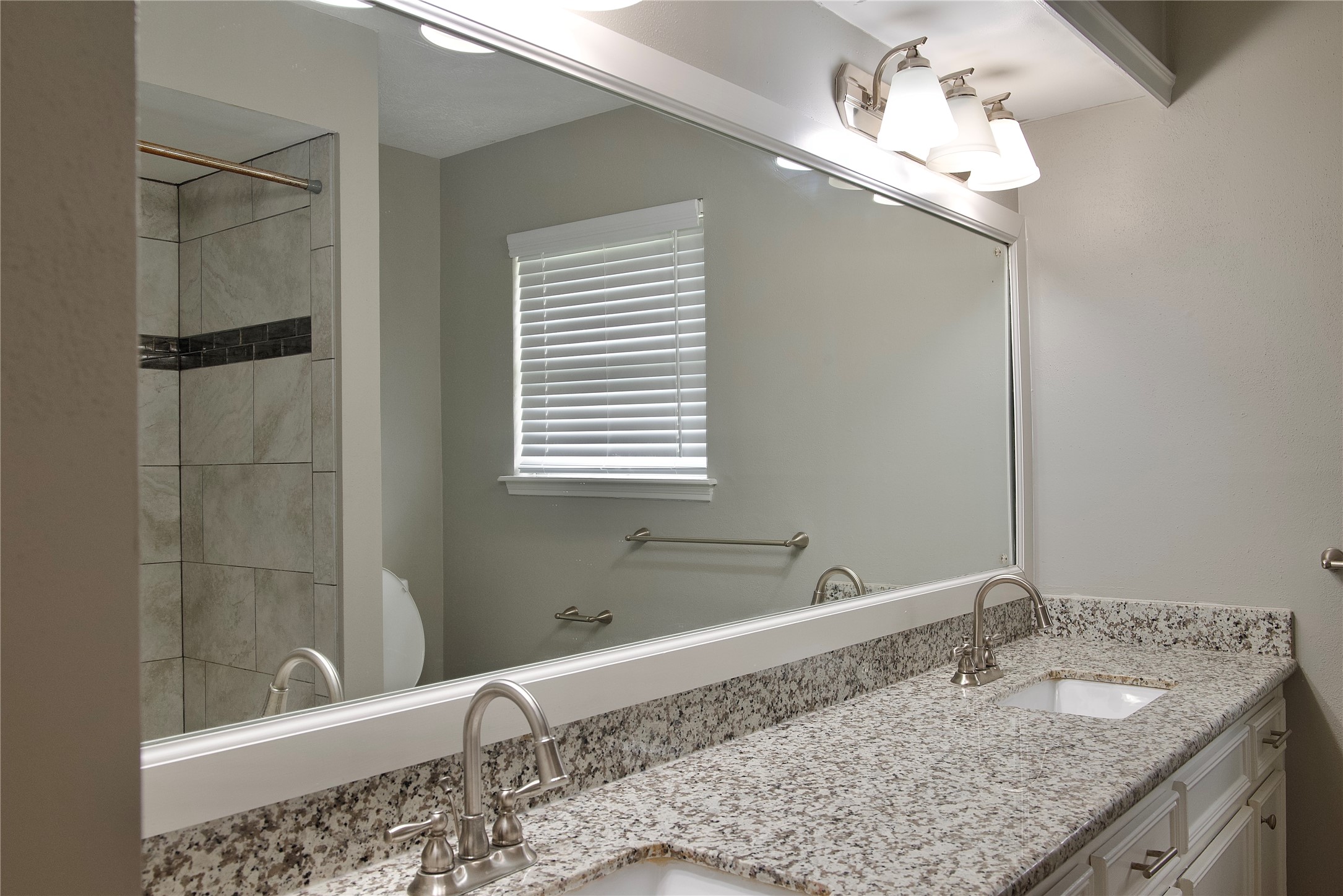 723 Leaflet Lane Spring, TX 77388 - Photo 33 of 41 a bathroom with a granite countertop sink and a mirror