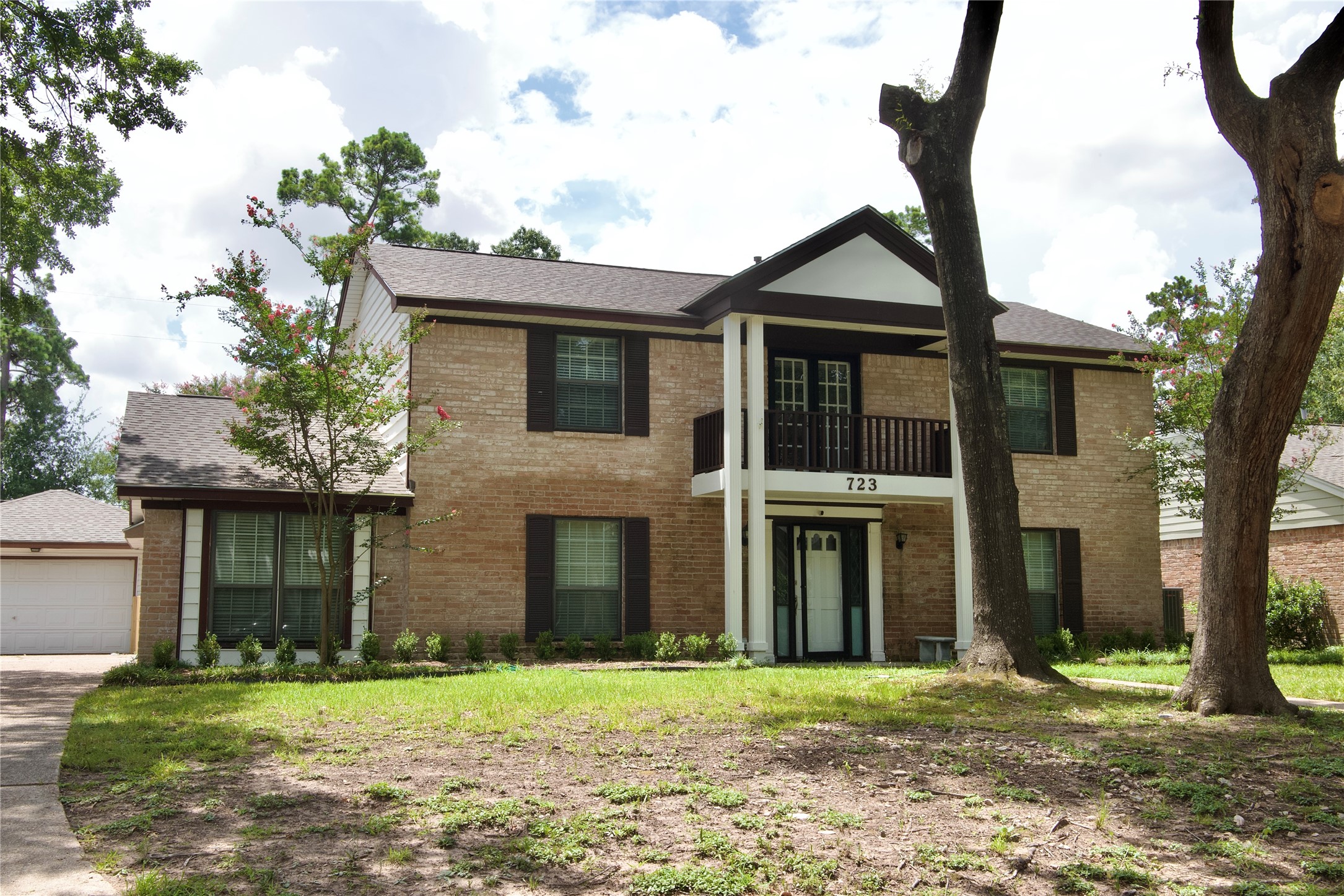 723 Leaflet Lane Spring, TX 77388 - Photo 5 of 41 a front view of a house with a yard and garage