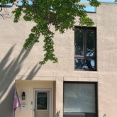a view of front a house with a tree