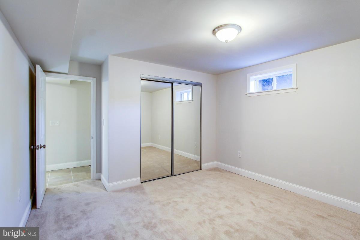 3101 Tucker Road Fort Washington, MD 20744 - Photo 22 of 30 an empty room with a fan