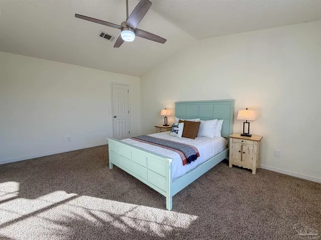 a bed room with a bed and a night stand