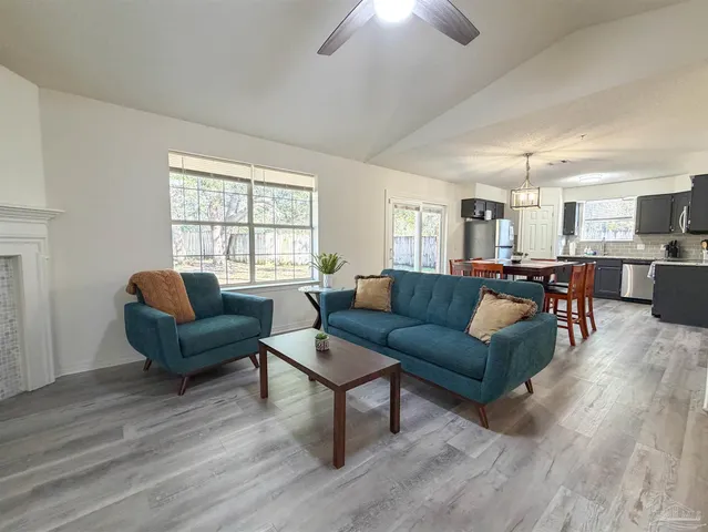 a living room with furniture and a large window