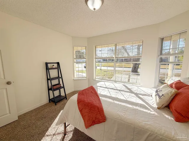 a bedroom with a bed and walk in closet