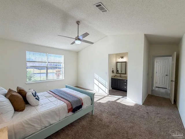 a bedroom with bed and a window