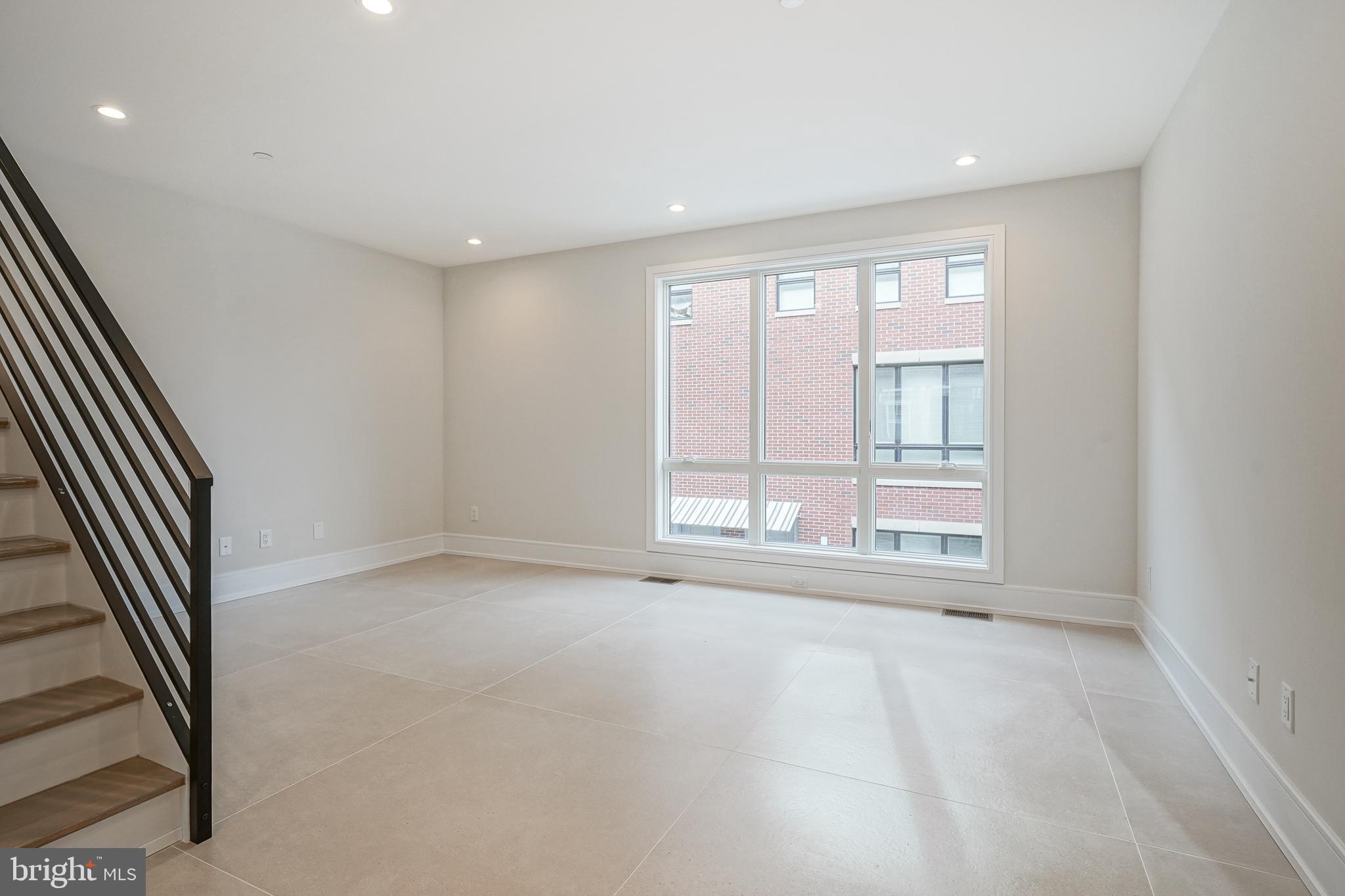 2002 Renaissance Walk, Unit 2 Philadelphia, PA 19145 - Photo 22 of 66 Living room flows elegantly into dining / kitchen
