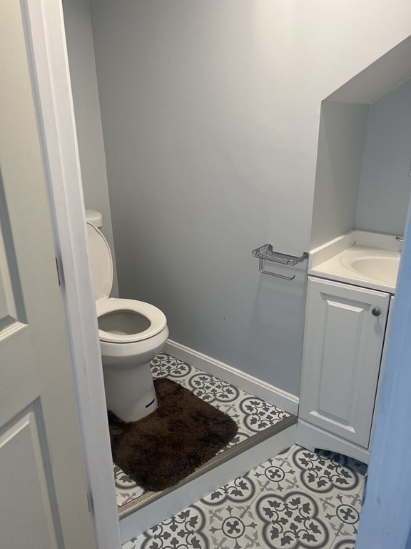 73 Brow Street Fall River, MA 02721 - Photo 8 of 9 a bathroom with a toilet and a window