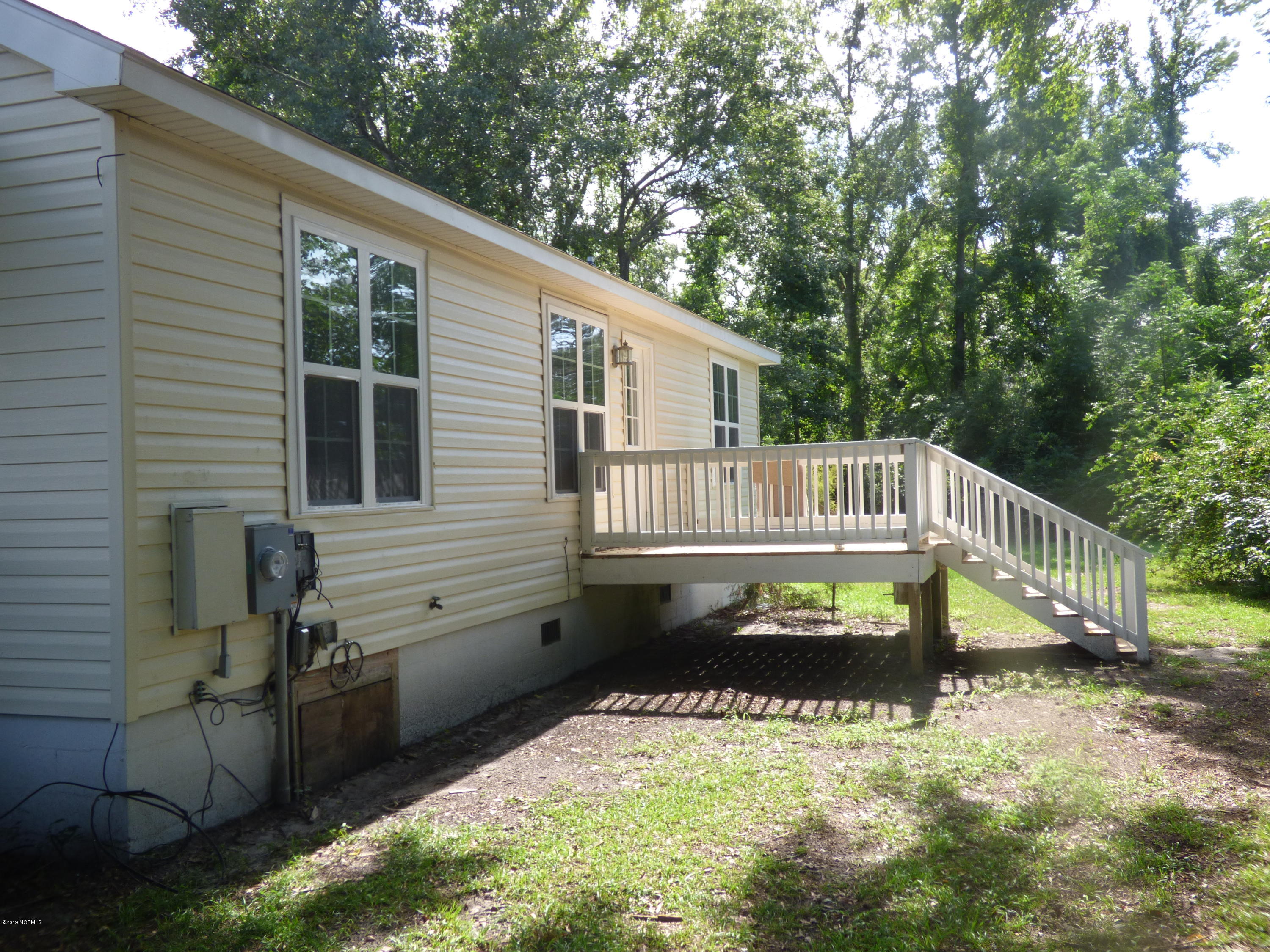 1313 Lanvale Road Leland, NC 28451 - Photo 3 of 11 Side View with Deck
