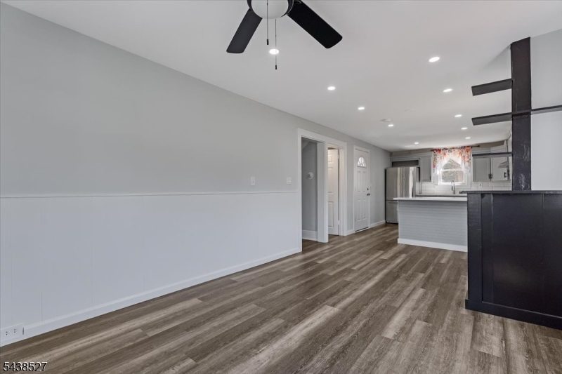 83 Highway 15 Lafayette, NJ 07848 - Photo 20 of 20 a view of kitchen and empty room with wooden floor
