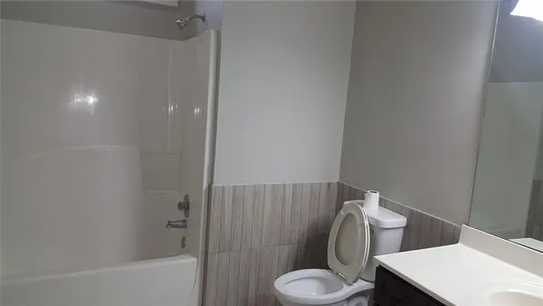 a bathroom with a sink and toilet
