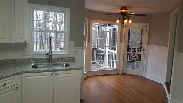 a kitchen with sink and window