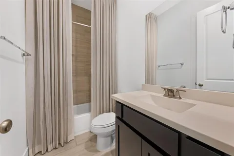 an empty room with closet and windows