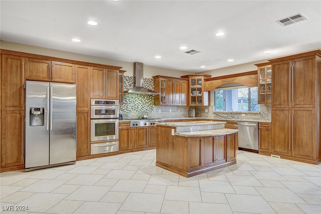 1118 Riddle Glen Street Henderson, NV 89012 - Photo 23 of 82 Gourmet Kitchen: Bright, open, and seamlessly connected to the living and dining areas—perfect for hosting and gathering.