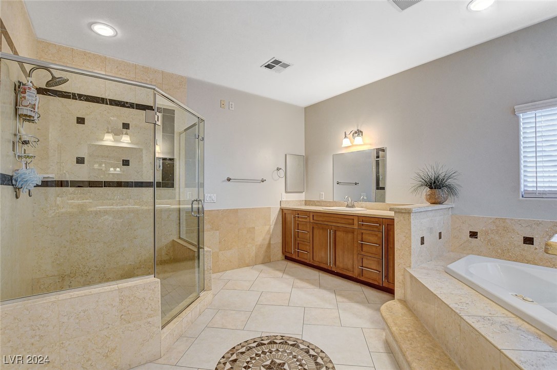 1118 Riddle Glen Street Henderson, NV 89012 - Photo 45 of 82 The suite also features a spa-like bath and dual walk-in closets for ultimate comfort and luxury.
