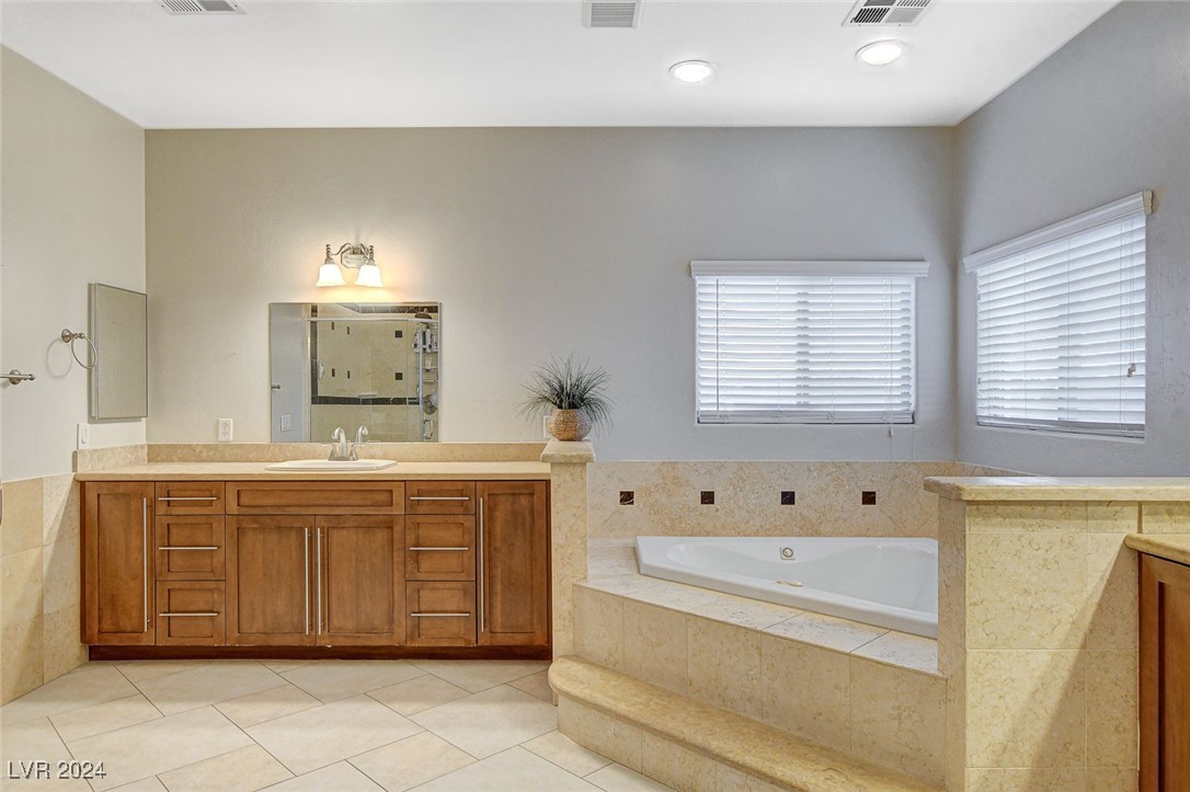 1118 Riddle Glen Street Henderson, NV 89012 - Photo 46 of 82 The suite also features a spa-like bath and dual walk-in closets for ultimate comfort and luxury.