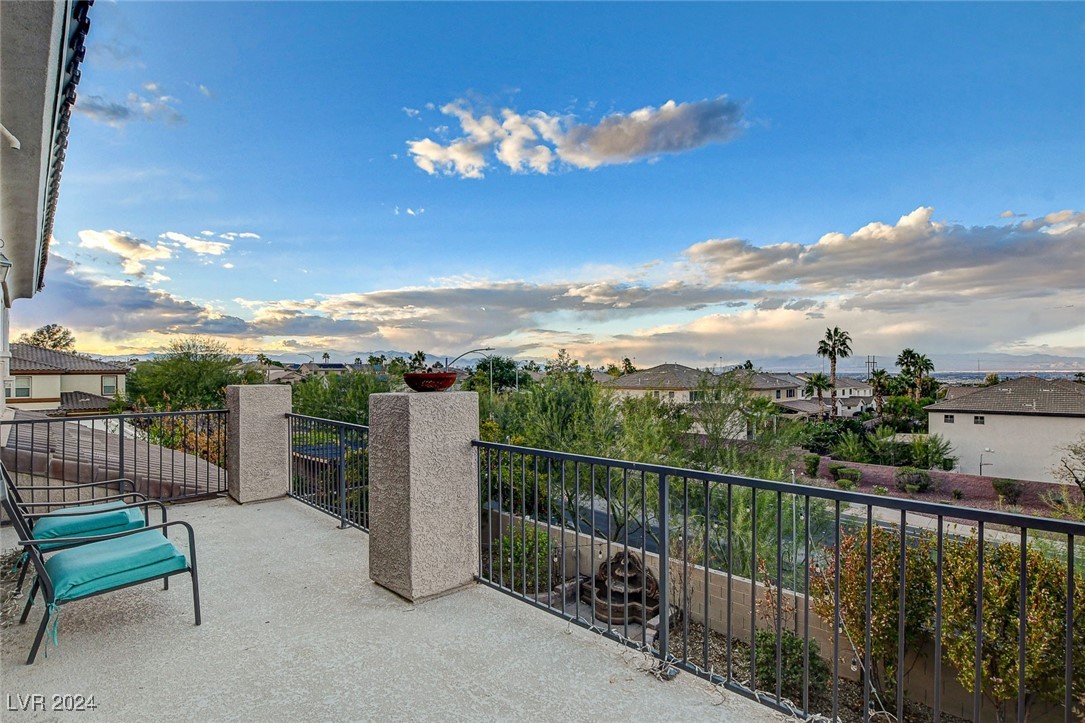 1118 Riddle Glen Street Henderson, NV 89012 - Photo 5 of 82 Primary Suite Retreat: A grand sanctuary with a private balcony offering breathtaking views of city lights, the mountains, and the Las Vegas Strip.