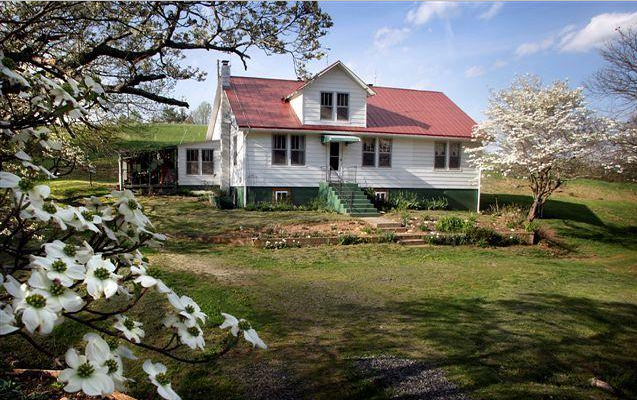 747 Graham Road Northwest Willis, VA 24380 - Photo 1 of 17 a front view of a house with a yard