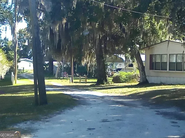 a view of swimming pool with trees