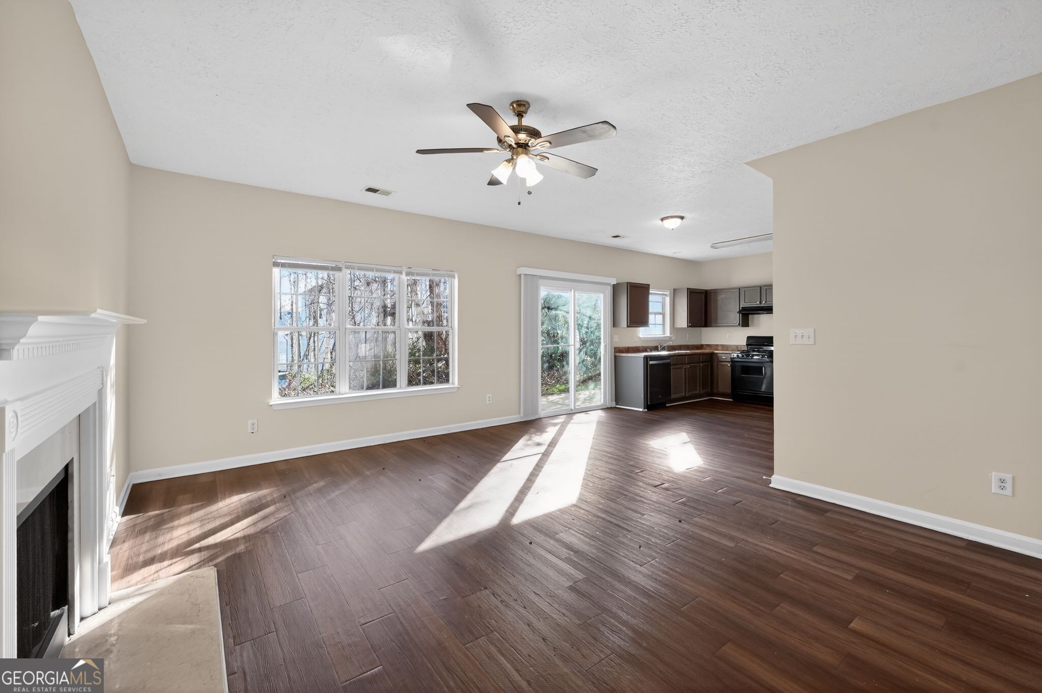 4292 Linecrest Lane Ellenwood, GA 30294 - Photo 12 of 33 a view of livingroom with hardwood floor and a ceiling fan
