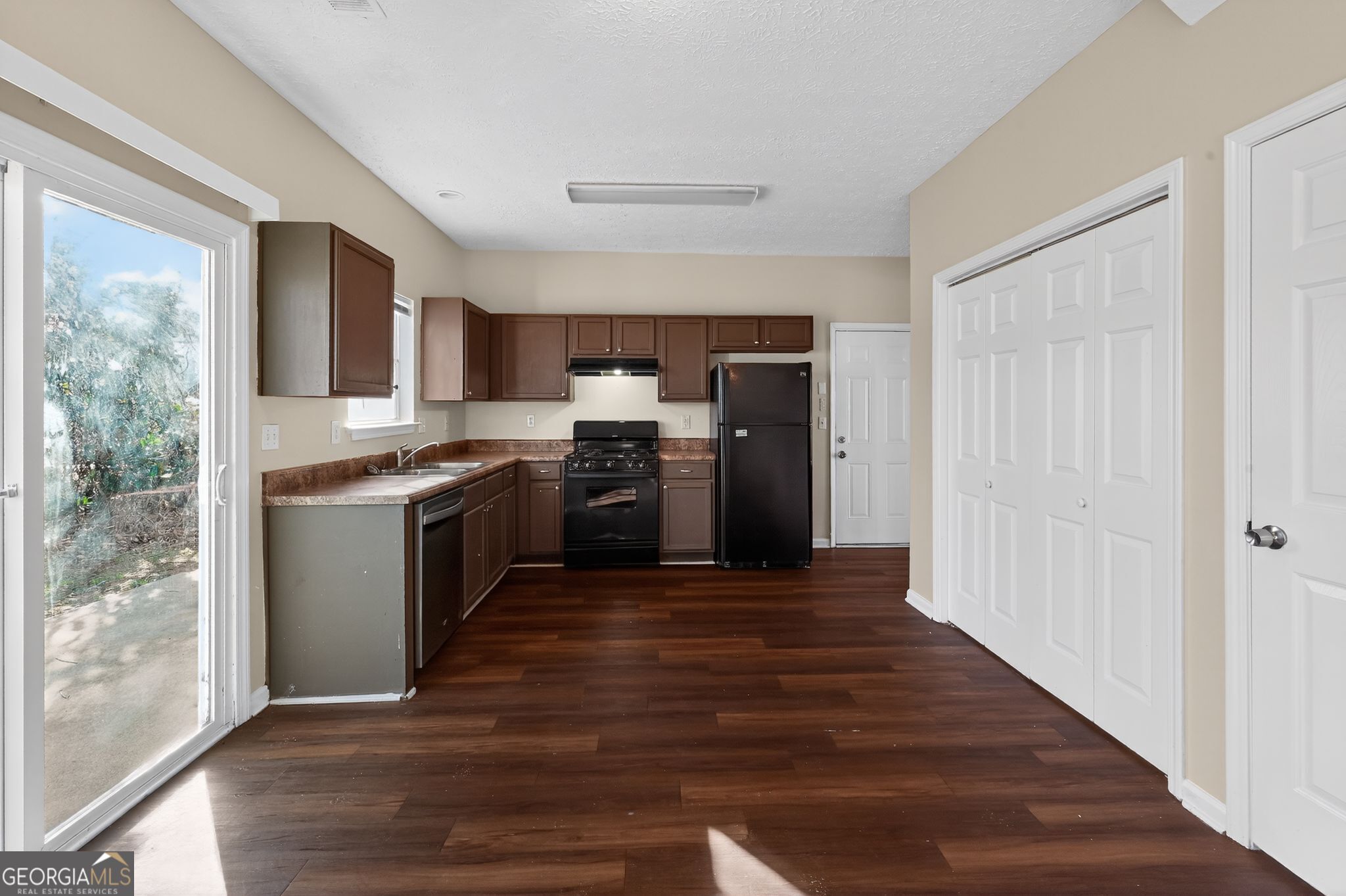 4292 Linecrest Lane Ellenwood, GA 30294 - Photo 14 of 33 a kitchen with stainless steel appliances granite countertop a stove top oven and sink