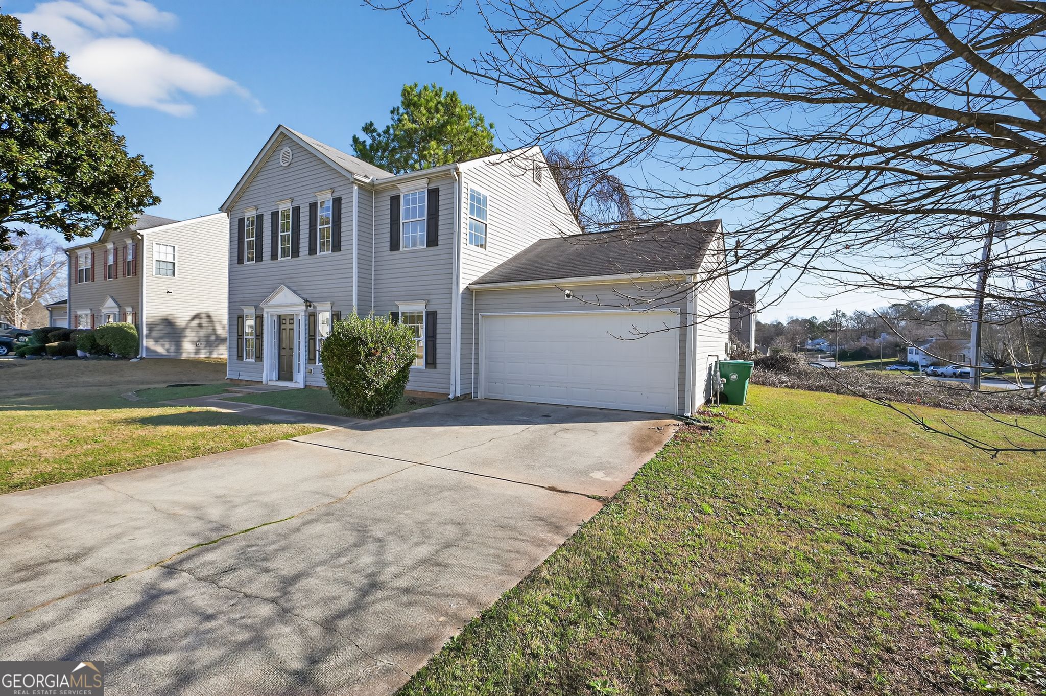 4292 Linecrest Lane Ellenwood, GA 30294 - Photo 2 of 33 a front view of a house with a yard and garage