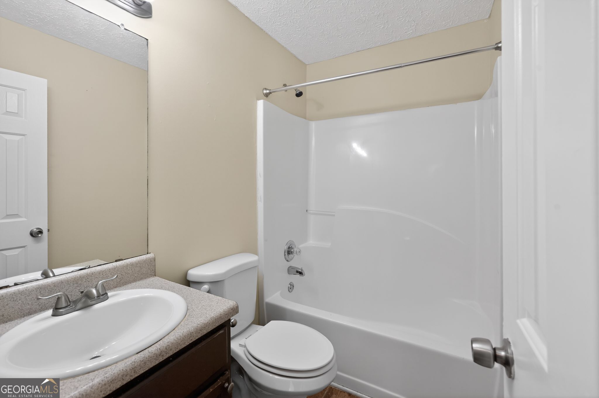 4292 Linecrest Lane Ellenwood, GA 30294 - Photo 25 of 33 a bathroom with a sink toilet vanity and shower